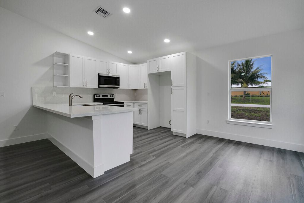 Photo of 8003 Hibiscus Road, Fort Pierce, FL 34951 (MLS # B26026170)