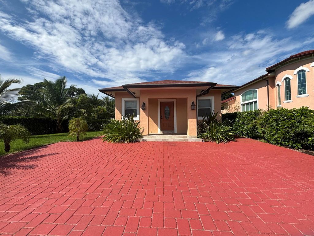 Photo of 4649 Lillian Avenue #A, Palm Beach Gardens, FL 33418 (MLS # R11024061)