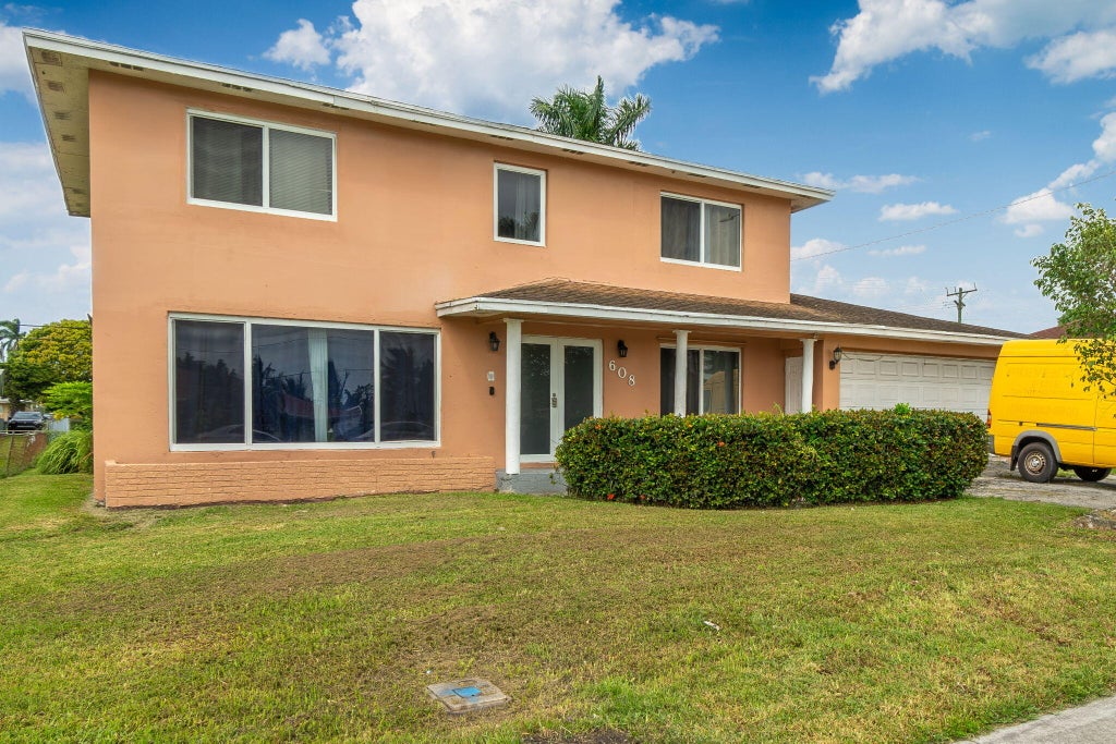Photo of 608 SW 10TH Street, Belle Glade, FL 33430 (MLS # B26093225)