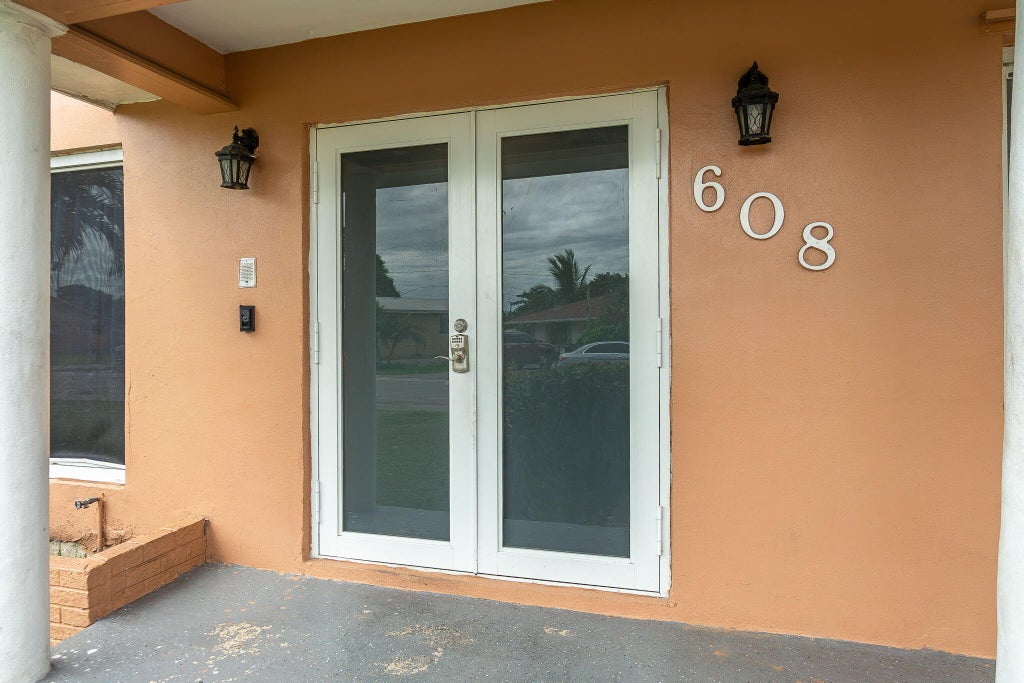 Photo of 608 SW 10TH Street, Belle Glade, FL 33430 (MLS # B26093225)