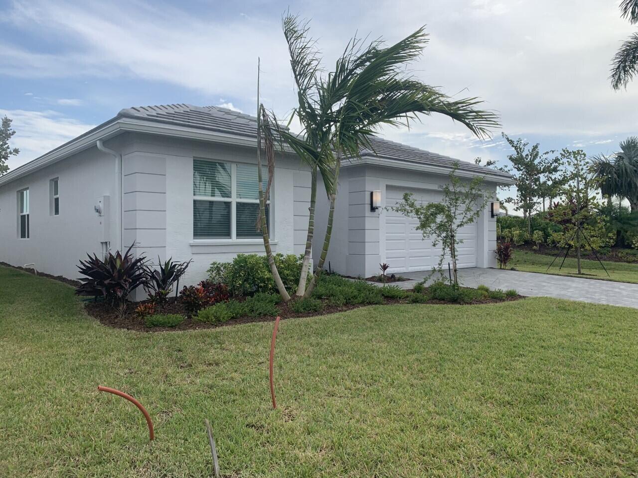 Available 09/01/2025. Look no further...you just found your little piece of paradise to spend time in sunny Florida! in the quaint gated community of Valencia Grove at Riverland in the area of Tradition. This Beautiful 3 bed/3bath/2 car garage, Bimini Model home has an incredible water/ club house views and walking distance to the club house. Tenant will have access to the Resort style amenities, 34,000 sf social clubhouse, restaurant and outside bar, arts & culture center, 40+ courts (tennis & pickleball), fitness facility with 5 indoor/ outdoor pools,3 card rooms, poker room w/2 billiard tables, multi-purpose room w/2 ping-pong tables. paseo greenway for traffic free strolling, biking or golf cart fun & non stop social events.