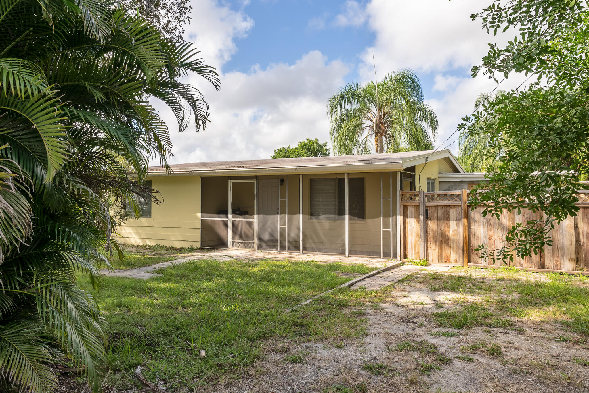 Located in the highly sought after Florida Gardens, this 2 bed 1 bath property is a HOT commodity. It sits comfortably on a 16,500 square foot lot that all of your toys will fit on, has been recently renovated and even has an attached carport and a detached garage with beautiful wood plank floors that can be used as storage or a man cave or quite literally anything you can think of! Schedule a tour ASAP as this home will not last!