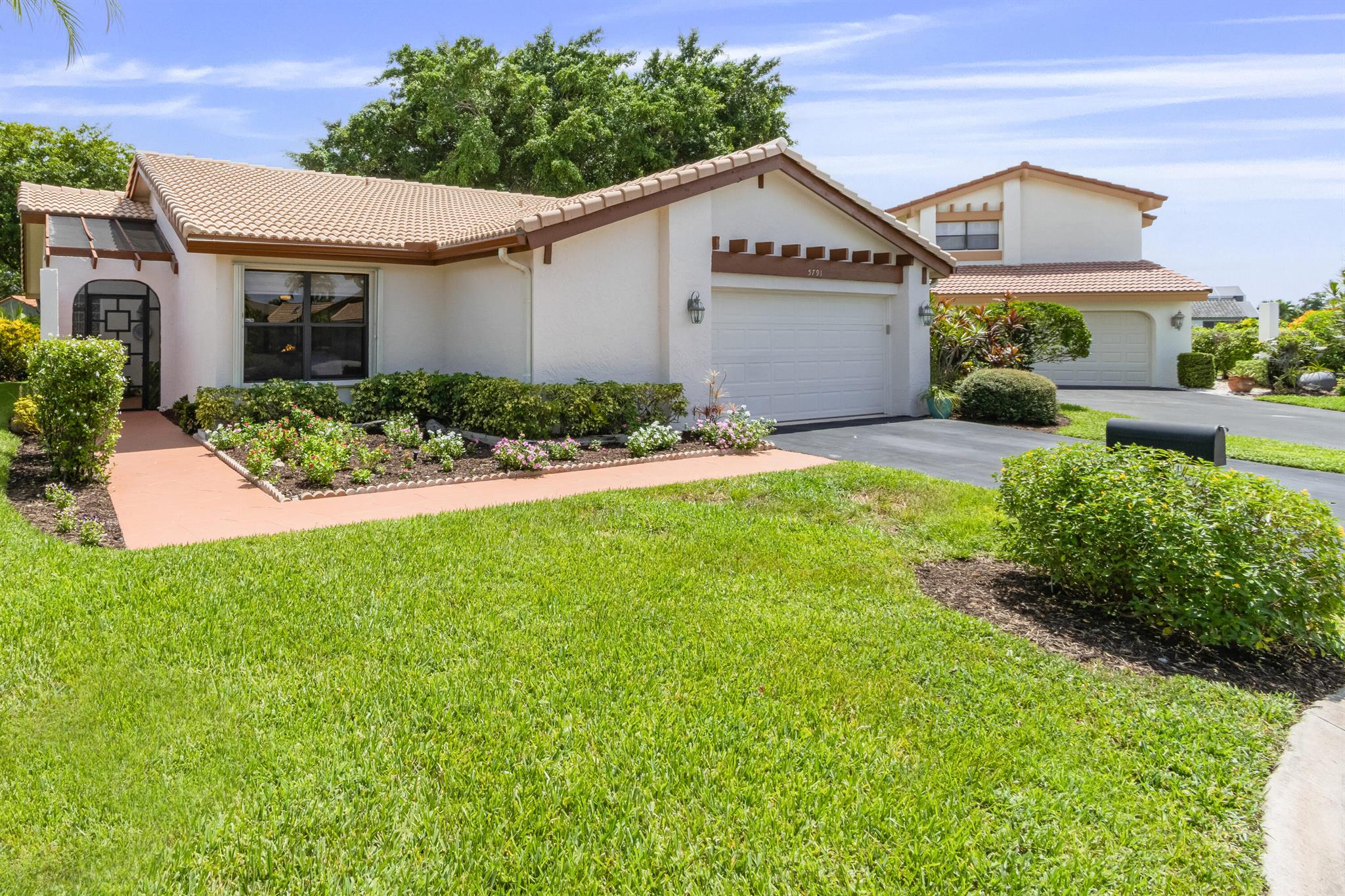 Well-loved two bedroom/two bath single family home located in Indian Springs (NO MEMBERSHIP REQUIRED). Recently renovated Florida Room w/ removable windows offers an ADDITIONAL 260 SQFT of living space that can be used ALL YEAR LONG. It is perfect for entertaining guests or simply enjoying Florida Living! Eat-In kitchen w/ wood cabinets, pull-outs, granite countertops & newer s/s appliances. Open & Spacious Family/Dining Room area w/ vaulted ceiling. NO carpets! Washer/Dryer located inside. Situated on a quiet cul-de-sac w/ plush landscaping, private side entrance and attached garage. Exterior freshly painted March 2025. Hot Water Heater replaced in 2024. Located just one block from the community pool & clubhouse. Within miles of the beach and major highways. Club Membership Available.