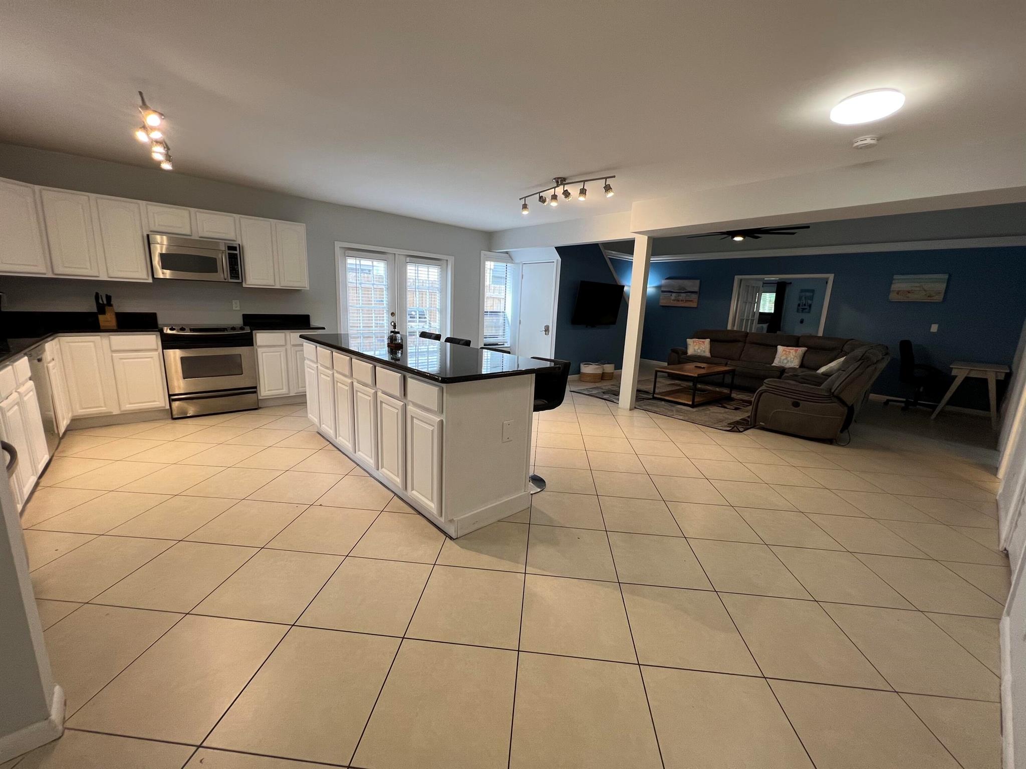 Furnished 3/2 in east delray. 1 mile from the beach right across the street from whole foods. minutes from downtown Atlantic ave. Large open kitchen with island.