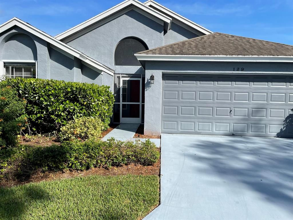 Photo of 129 Hammocks Drive Dr, Green Acres, FL 33413 (MLS # R10750341)
