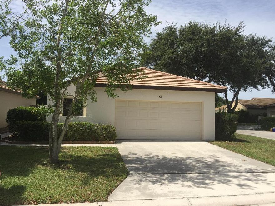 PGA National Golf Course gated community!  This corner unit features an open living area open to a private fenced backyard, eat-in kitchen, dining area and den/office or 3rd bedroom plus 2-car garage.  Tile floors throughout. No mandatory country club membership. This is a Fannie Mae Homepath property!