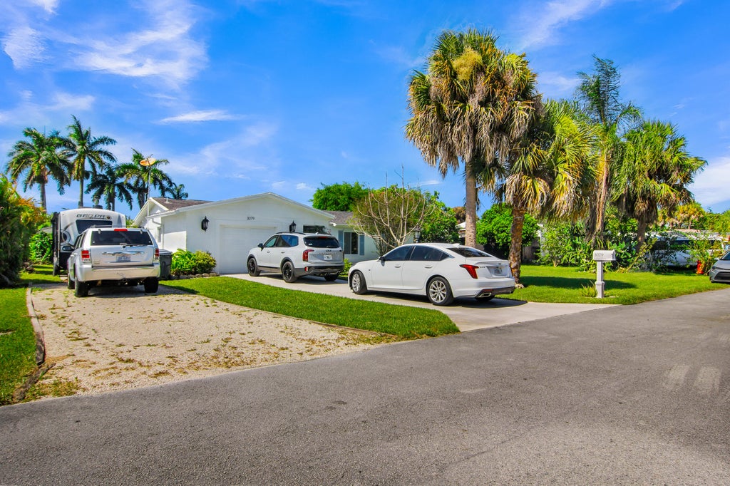Photo of 3079 Indian Trail, Lake Worth, FL 33462 (MLS # B26052738)