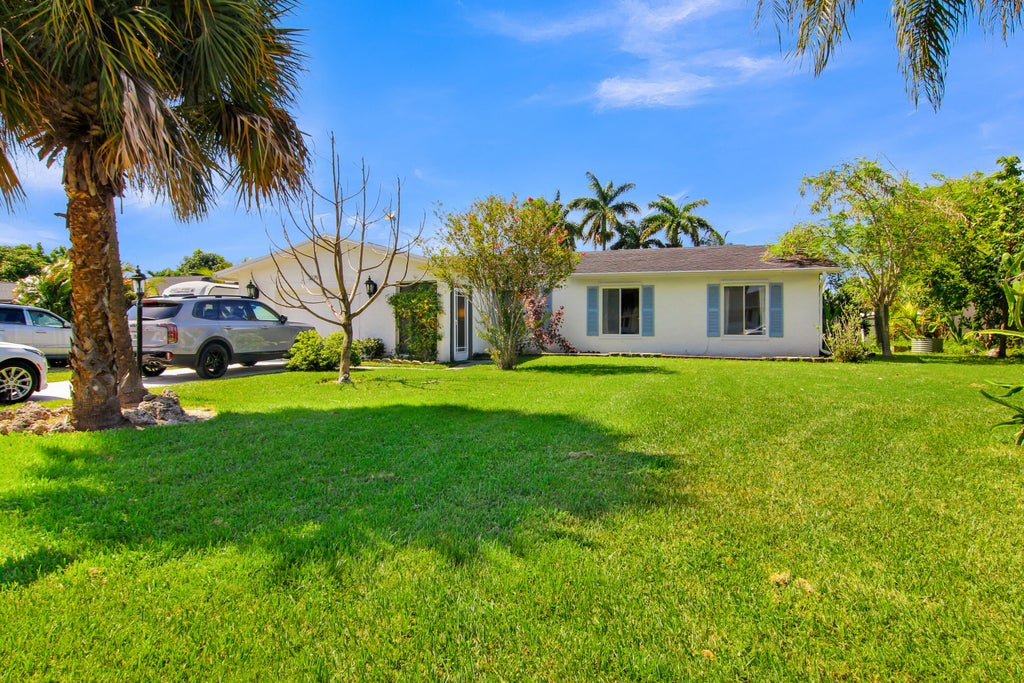 Photo of 3079 Indian Trail, Lake Worth, FL 33462 (MLS # B26052738)