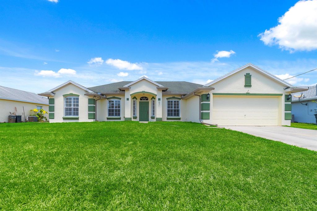 Photo of 831 SW Idol Avenue, Port Saint Lucie, FL 34953 (MLS # R10979278)