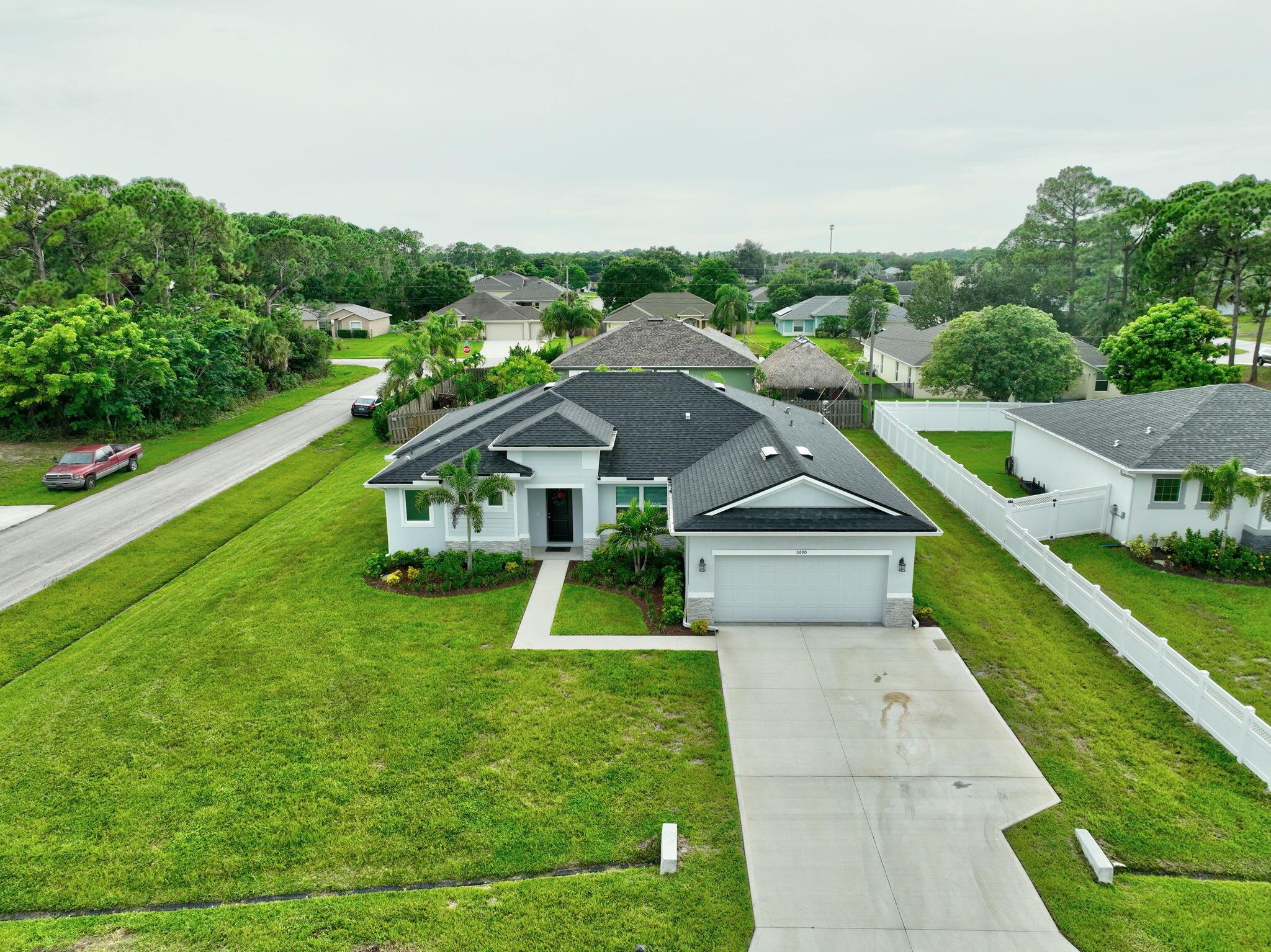 Custom Home built in 2024. CARHARP Builders and this model is The Coastal.Impact Glass Throughout. Upgraded tile throughout. Upgraded Blinds throughout. Quartz countertops in kitchen and bathrooms.Gutters are New. Driveway has an extended area for oversized vehicles. 5x26ft extended.Nice office off of the livingroom, or could be a nursery. Better than new. Top of the line Washer and Dryer. Walk in closets. MUST SEE