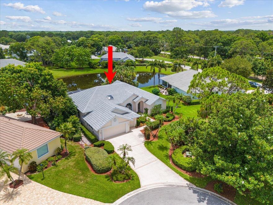 Sought-After Callaway Place in Prestigious PGA Village! You will love this beautifully updated three-bedroom, two-bath pool home perfectly situated on a quiet cul-de-sac with stunning lake views. Featuring a spacious 2.5-car garage with an additional work area This home offers the ideal blend of style and functionality.Highlights include a BRAND NEW ROOF (2025) and a designer kitchen boasting granite countertops, SS appliances, double ovens, cooktop, an abundance of cabinetry, top-of-the-line light fixtures -- all complemented by wood-look tile flooring.Enjoy the Florida lifestyle year-round with your own private pool overlooking the serene lake. The spacious owner's suite features double walk-in closets, newer seamless glass shower doors, and gorgeous views of the pool and lake.