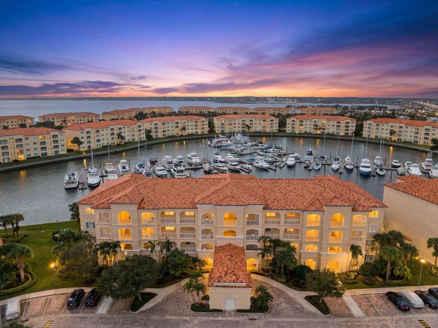One of the best Harbour Isle units, perfectly positioned for full marina views, passing boats, and stunning sunsets. This fully upgraded 2BR/2BA waterfront residence features two private suites, including a guest suite with its own entry—ideal for entertaining or extended stays. Interior highlights include porcelain wood-look tile throughout, tongue-and-groove ceilings, recessed lighting, crown molding, ceiling fans, custom motorized blinds, and upgraded interior finishes. The gourmet kitchen offers high-end appliances and custom details. New washer and dryer included. Harbour Isle provides resort-style amenities with clubhouse, pool, fitness center, tennis, pickleball, marina access, and close proximity to beaches, downtown Fort Pierce, dining, and world-class fishing.  Move in Ready!