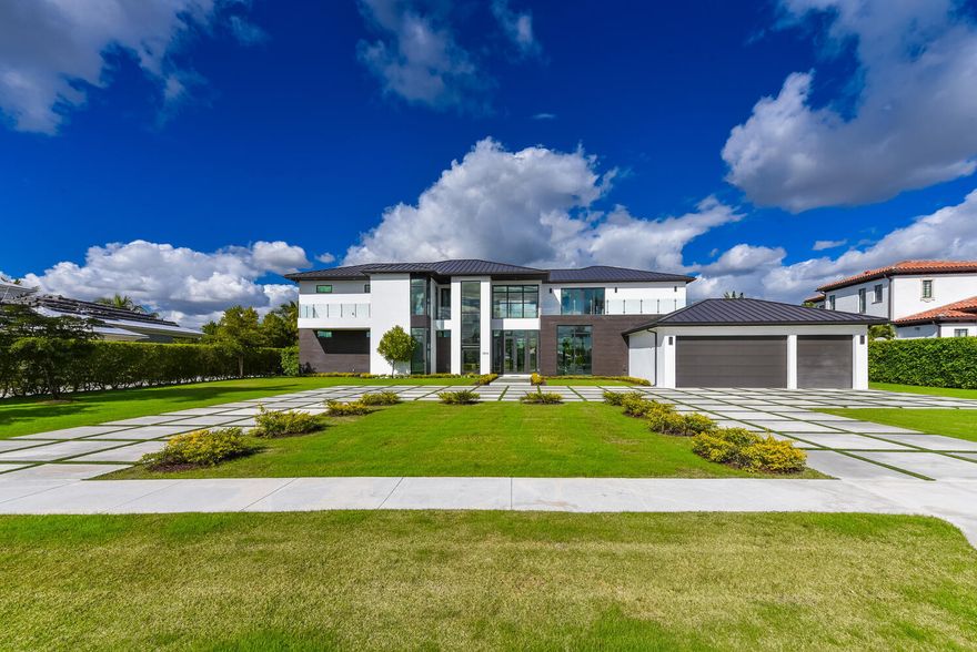 Palm Beach Polo & Country Club located in Wellington, Fl A truly spectacular new construction modern estate on an expansive 26,310 square foot waterfront lot in the coveted Cypress Island Way. This two-story estate offers 9,000+ square feet of living area 6 bedrooms, 7 bathrooms, 3 car garage, saltwater pool, top of the line living appliances, and many more luxury features and finishes. READY TO MOVE IN! Palm Beach Polo & Country Club is a benchmark for luxury living in Wellington, the equestrian capital of the world. The club offers a championship golf course, elegant clubhouse, tennis facilities, polo fields, and plenty of social activities for the family. Call Today! This estate is a must-see.