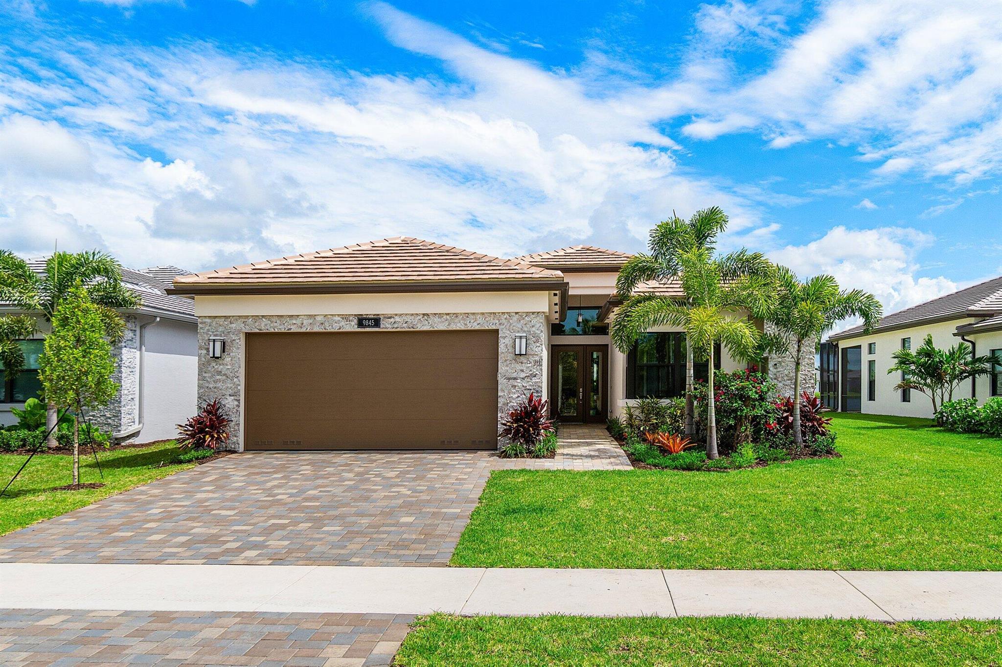 Heated Pool/Spa/Partial Lake View - Valencia Grand builder quick delivery home across from small ''park area''. Immediate Delivery Aruba Grande Model with 2 Bedrooms plus a Den, Great Room and 2.5 Baths. Upgrades include impact glass windows gas appliances, wood floors and so much more. Call for the full list of upgrades. Amenities includes a full service restaurant, Indoor pickleball, 44,000 square foot clubhouse, indoor/outdoor bar, pools, tennis and more. Additional closing cost incentives may apply. Incentives may change at any time. Call for more details.
