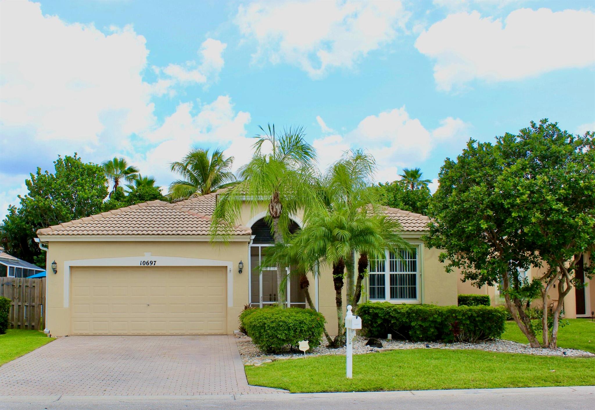 Located in the Heart of Wellington!! Great opportunity to put your personal touches on a fantastic home that backs up to a preserve! Possibilities are endless to update this 3/2 split floor plan into your dream home. Large screened in partially covered back patio with NO NEIGHBORS behind you! Full Accordion hurricane protection installed 2 years ago. 2014 Carrier AC unit. If you are looking for an immediate rental investment, this is the perfect spot! Home is priced for current condition and age of roof. Rental property for the past 2+ years.