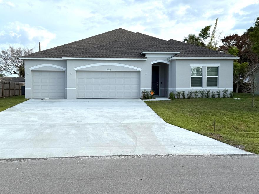 BRAND NEW CONSTRUCTION - MOVE IN NOW! This single story home features soaring 9'4" ceilings and an open-concept layout designed for modern living. The gourmet kitchen with quartz countertops flows seamlessly into the spacious great room. The private primary suite offers a walk-in closet and spa-style bath, while two secondary bedrooms share a full bath. A flexible guest room or office with adjacent third bath adds versatility. Enjoy the covered patio, three-car garage with utility sink, Energy Star windows, Ring Doorbell, Smart Thermostat, Keyless Entry, DEAKO smart switches, and Smart Vivint Alarm System. Located in Port St. Lucie near PGA Village, parks, dining, and beaches.