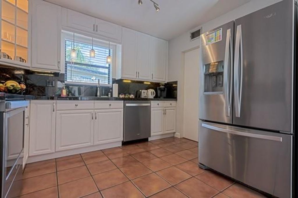 Photo of 1311 SW 56th Avenue, Plantation, FL 33317 (MLS # B26003377)