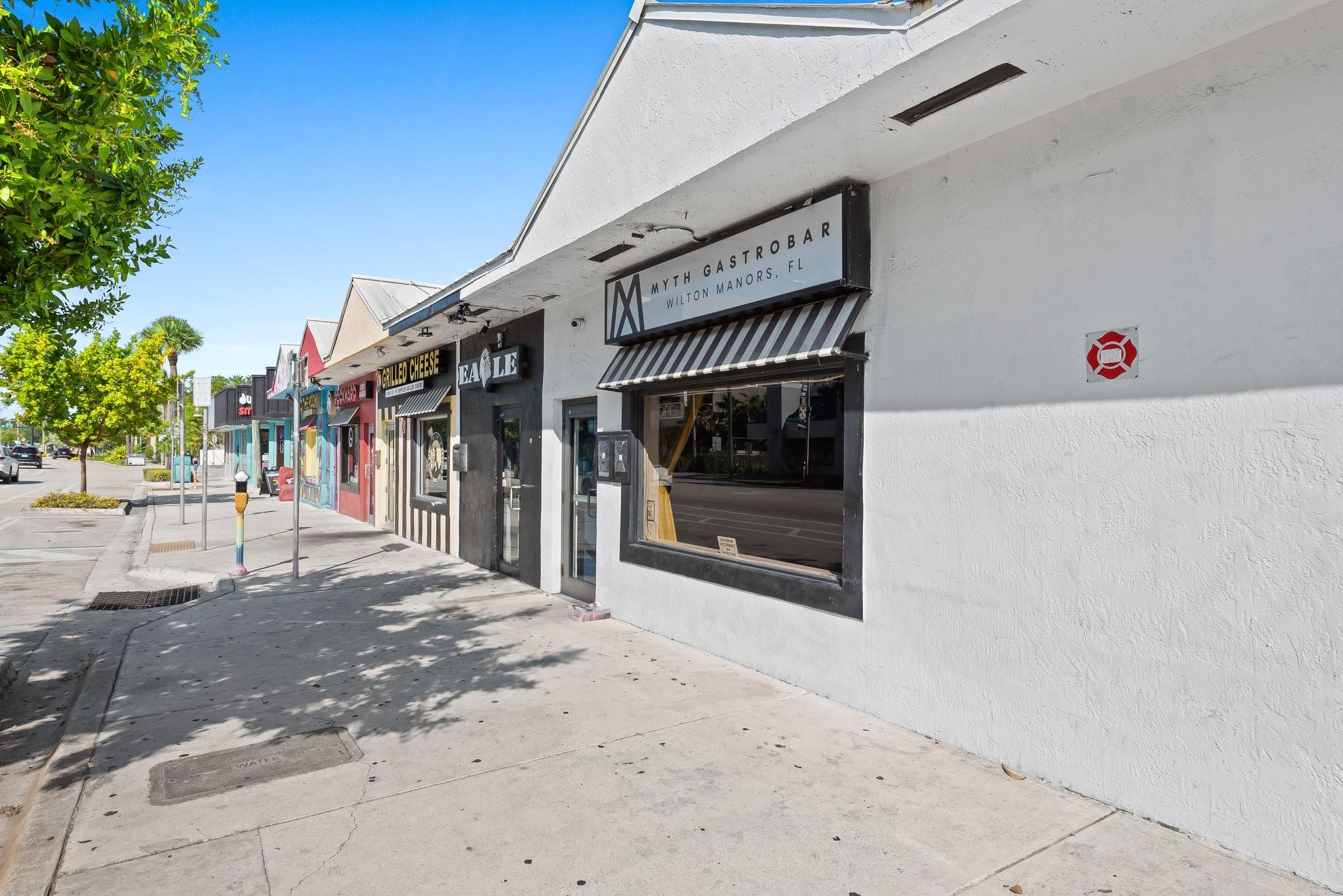 Now available: Turnkey second-gen restaurant/bar space in the heart of Wilton Manors’ Arts & Entertainment District. Formerly Courtyard Café and Myth Lounge, the space includes a fully built-out kitchen with hood and grease trap, plus exclusive use of a covered outdoor courtyard—perfect for dining or events. Located on busy Wilton Drive with high visibility and strong foot traffic. Surrounded by a vibrant mix of bars, restaurants, and retail in one of South Florida’s most dynamic and walkable communities. Ideal for experienced operators ready to launch quickly.
2,500 Square Feet (includes exclusive use of outside patio)
Price: $60/sf NNN (est. $17.20/sf)