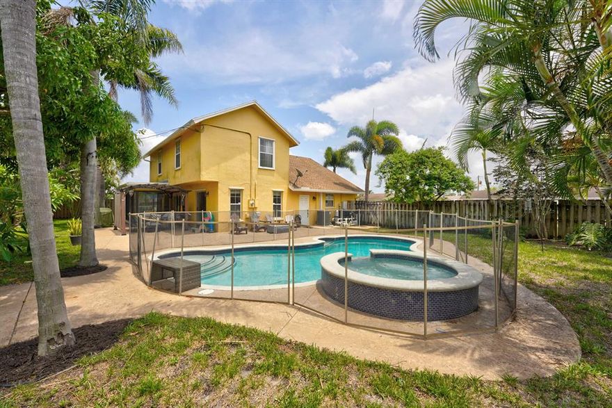 Welcome to the perfect non-HOA 3 bed, 2 bath pool home on an oversized lot in a family-friendly neighborhood.  The property offers the ultimate in family living with a stunning backyard with a large pool and jacuzzi. They are located in a central area in Boynton Beach, close to I-95 shops and restaurants. Step into high cathedral ceilings and marble floors below your feet. Open concept living gives the home a grand feel. The main bedroom downstairs with updated bathroom Updates includes brand new A/C, a modern updated bathroom with new vanity, backsplash, and fixtures. The kitchen has new appliances and Florida room dining with a great view. Upstairs features a nook with a home office and large bedrooms with great lighting Home is situated on the most oversized lot in the neighborhood.