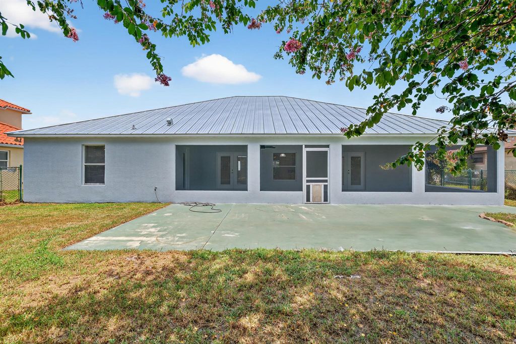 Photo of 538 SW Nadell Avenue, Port Saint Lucie, FL 34953 (MLS # R11109768)