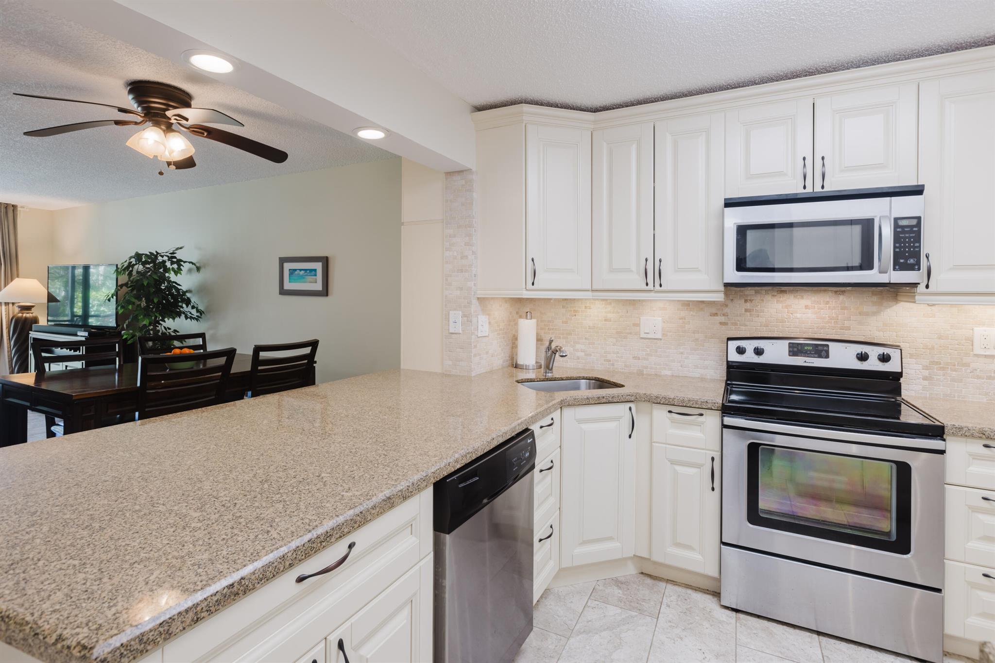TURNKEY HOME - JUST BRING YOUR TOOTHBRUSH! No upcoming assessments, fully funded reserves and passed the structural inspection.This spacious, fully renovated 2 bedroom, 2 bathroom first-floor corner unit offers a breathtaking view of the serene preserve. Move-in ready with modern finishes and a private back patio perfect for enjoying your morning coffee or dinner in a peaceful setting. New AC (2024).The HOA includes basic cable, elevator, landscaping, water, sewer, trash removal, common area maintenance, and building insurance, ensuring hassle-free living.Located in a fantastic community with incredible amenities, including multiple pools, a clubhouse, jogging and biking paths, tennis and pickleball courts.