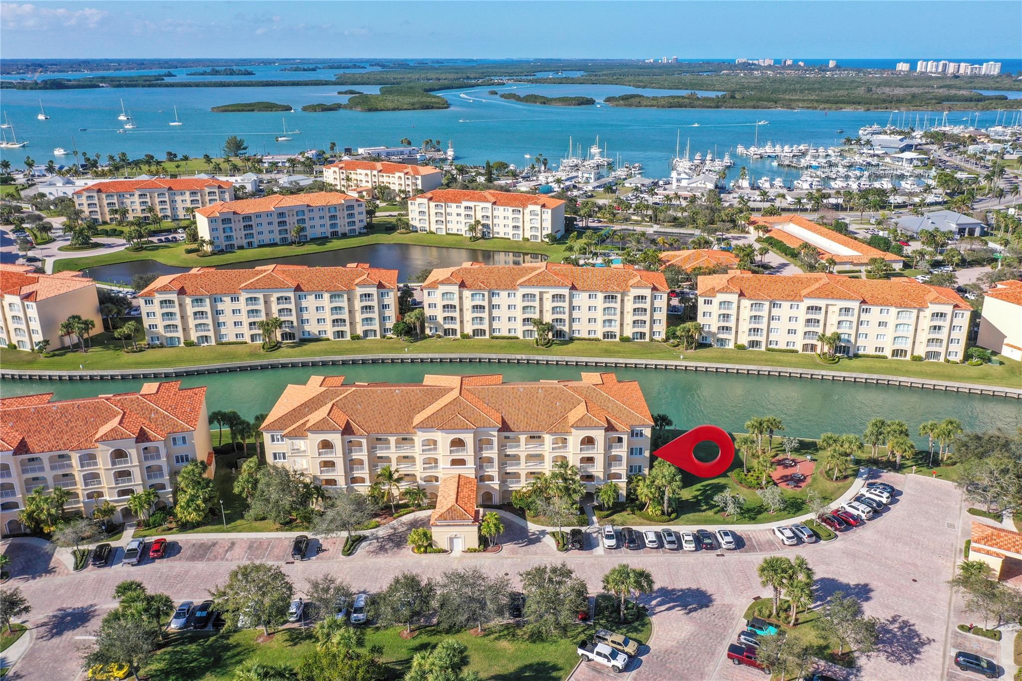 What a value for this fully furnished, END unit, 3rd floor condo! It offers a spectacular view of boats entering & leaving the marina & all the other marine life found in the intracoastal. Features include wood-like luxury laminate floors, new A/C (w/ transferrable warranty), newer hot water heater, LG black stainless appl, & crown molding. Sold turn-key so literally move in without a care in the world. Bldg 19 is close to grills & offers plenty of nearby guest parking. These condos were constructed w/ poured concrete walls, impact windows/doors, high ceilings, open floorplans, flex room off laundry room for office/add'l sleeping, 24-hour security guard, & outstanding amenities including club-like pool, gym, walking paths, & clubroom. Walk to the inlet, tiki bars, & d'town Ft Pierce!