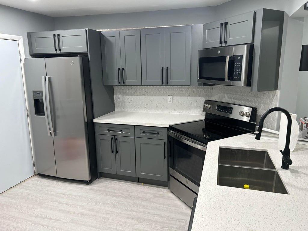 Photo of 6361 N FALLS CIR Drive #212, Lauderhill, FL 33319 (MLS # B26059228)