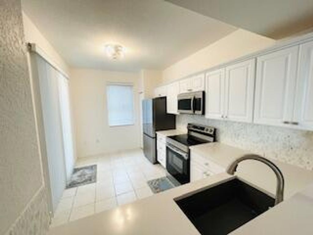 Photo of 11027 Legacy Boulevard #102, Palm Beach Gardens, FL 33410 (MLS # R11099495)