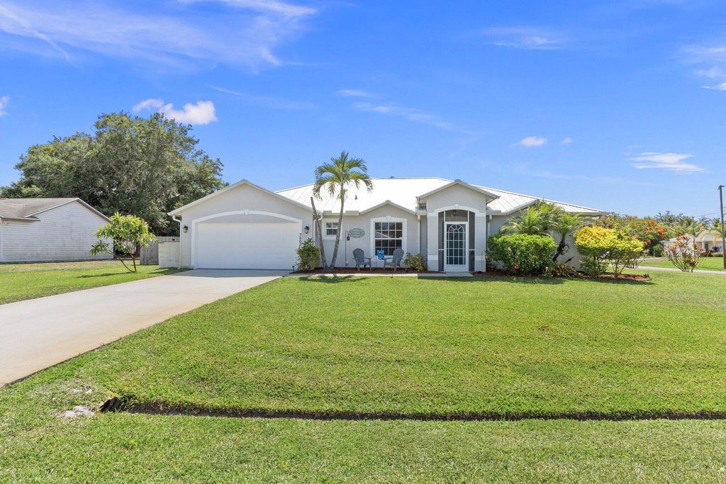 Photo of 3802 SW Hainlin Street, Port Saint Lucie, FL 34953 (MLS # R10992934)