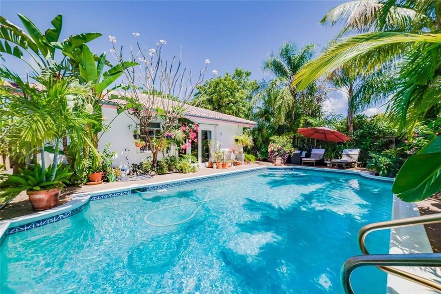 SPACIOUS PRIVATE 3 BEDROOM 2 BATH HOME.ADDITIONAL ROOM/OFFICE  CAN CONVERT TO A 4TH BEDROOM.SEPARATE  LIVING & SUN ROOMS OFFER SERENITY & CALMNESS.THE OPEN KITCHEN AND GREAT ROOM/DINING OFFERS VAULTED CEILINGS THE PERFECT SPACE  FOR ENTERTAINING. OUTSIDE OFFERS  LUSH TROPICAL GARDENS AND FRUIT TREES SURROUNDING THE PROPERTY & POOL AREA.1 CAR GARAGE*OUTDOOR SHOWER* HOUSE IS A MUST SEE TO TAKE IN ALL THE FEATURES IT HAS TO OFFER.