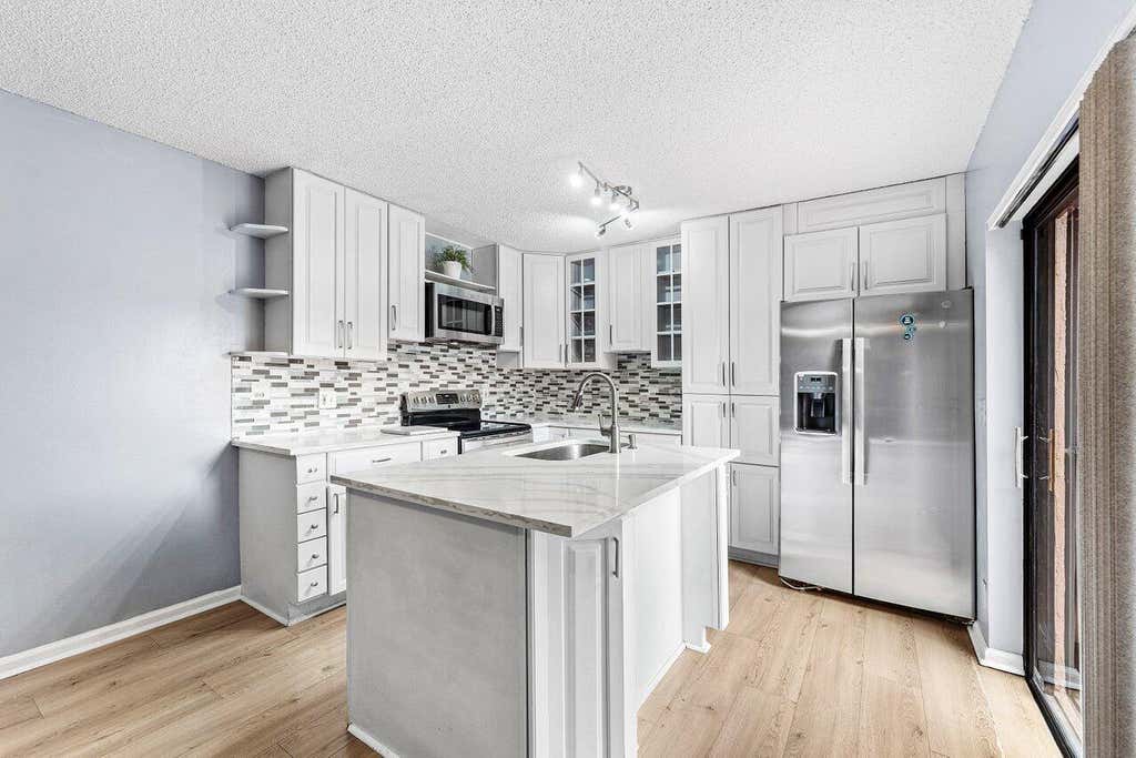 Photo of 6115 Seven Springs Boulevard, Greenacres, FL 33463 (MLS # B26033102)