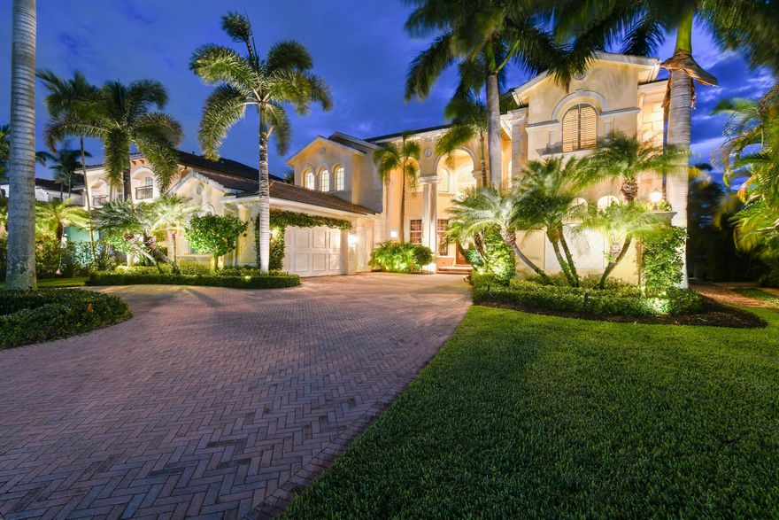 Discover unparalleled elegance in this estate home at 615 Hermitage Circle, a customized Villa Rosa, nestled within the prestigious Frenchman's Reserve in Palm Beach Gardens. A rare gem, this luxury residence offers sweeping vistas of the tranquil lake and the 18th hole of the championship golf course, with a backdrop of lush natural Florida greenery. This upgraded and expanded floorplan features 6 full bedrooms, 6 full bathrooms, 2 half bathrooms and a spacious office. From the moment you open the double doors you are welcomed with sweeping views, natural light and openness from the 24' ceilings and floor-to-ceiling wall of windows. An elegant entryway invites you to the formal spaces, with a full seating wet-bar and custom fireplace, rounding out the ideal entertainment space!