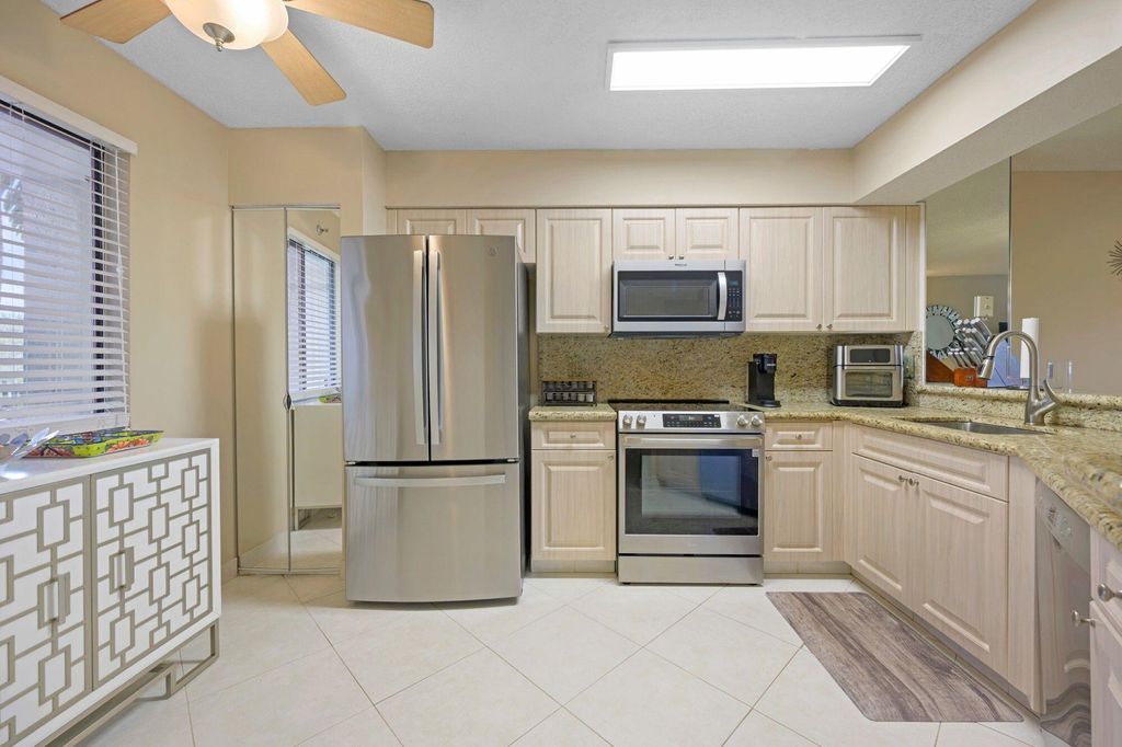 Photo of 2334 S Cypress Bend Dr #308, Pompano Beach, FL 33069 (MLS # B26000661)