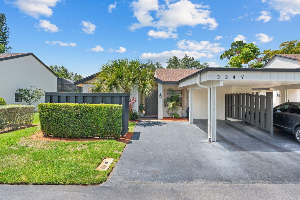 Photo of 2247 Deer Creek Woodlands Way, Deerfield Beach, FL 33442 (MLS # B26041043)