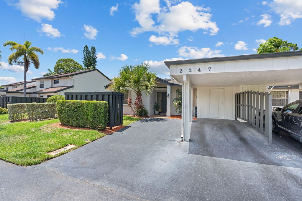 Photo of 2247 Deer Creek Woodlands Way, Deerfield Beach, FL 33442 (MLS # B26041043)