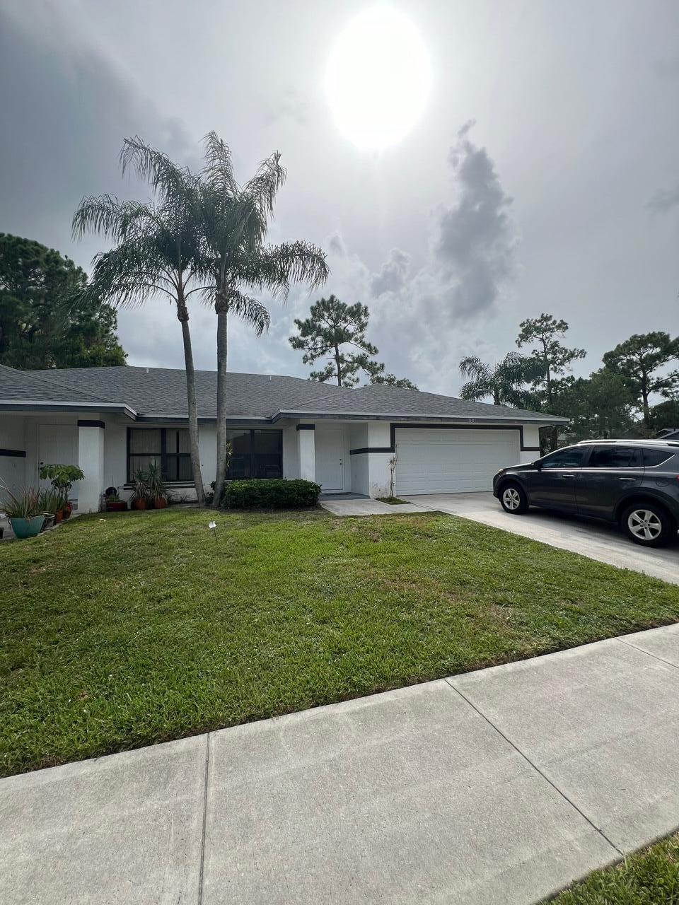 Very Spacious unit, 2 car garage! Freshly painted inside, updated bathroom, frameless shower doors, washer and dryer in separate laundry room, screened in back porch with a fully fenced back yard. Approx 1+ miles to Showgrounds, and walking distance to Publix/restaurants on Greenview shores! This is a year lease only.