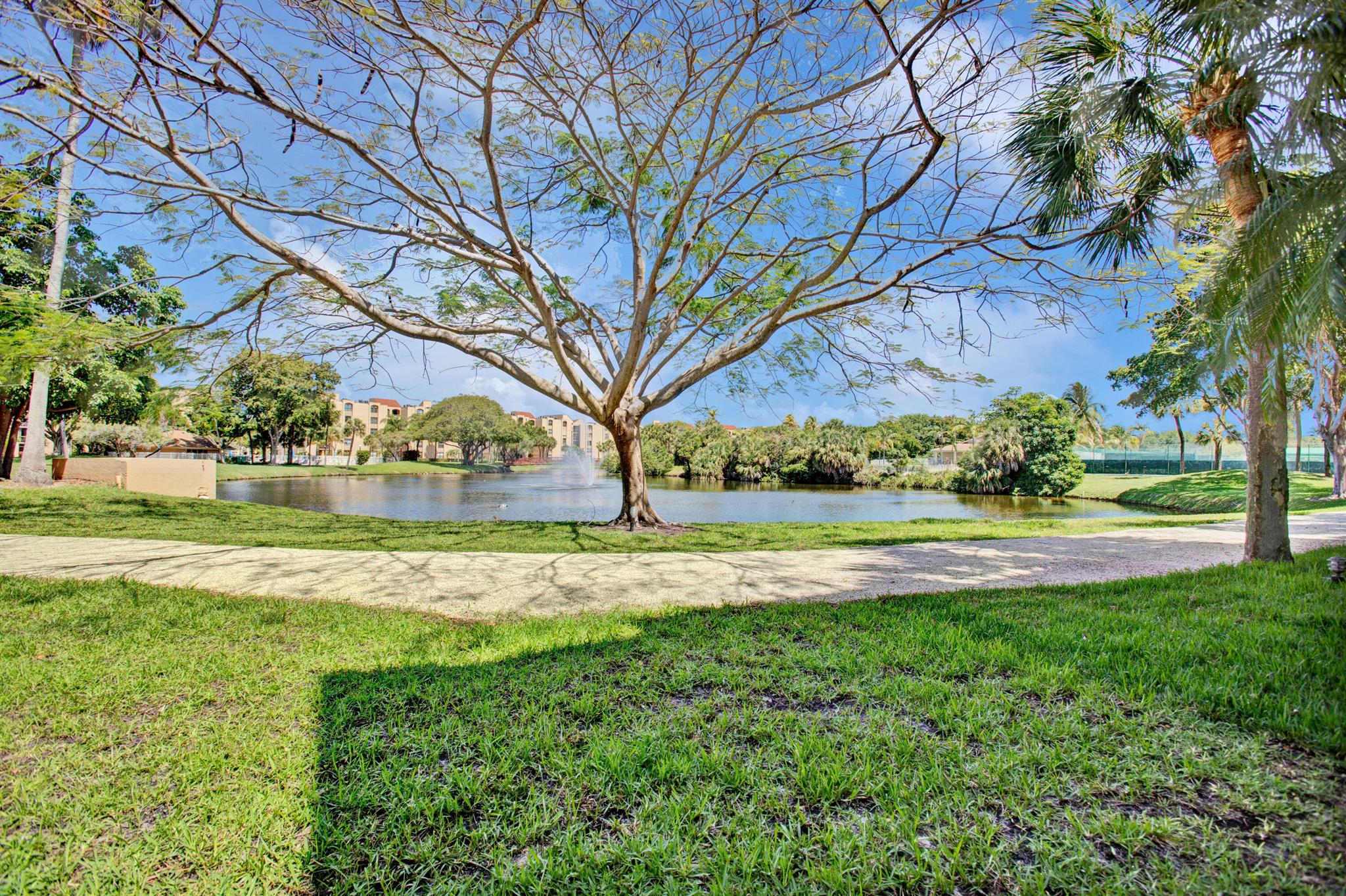 ABSOLUTELY GORGEOUS WATER VIEW CONDO IN DELRAY BEACH ! Highly desirable location, Unit can be rented Furnished for Long term or Short term. This Beautiful 2 Bedroom 2 Bath Lake view -front covered courtyard unit, located in Delray Racquet Club, features a light and bright open floor plan, split bedroom, washer and dryer in the unit. Spacious kitchen, tile flooring throughout, and a screened in private patio overlooking the Lake. WiFi, cable, water & parking are included. This beautiful community offers jogging/walking trails around the lake, 2 heated pools, Spa/Hot tub, Tennis Courts, Racquetball Courts, and Fitness Center. Wonderful location within walking distance to Whole Foods, Publix, Target, Trader Joe's, minutes from the beach and Downtown, close to I-95.