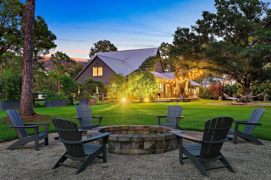 Modern Farmhouse Retreat on 2.5 Acres -- Escape to this stunning 4-bedroom, 3.5-bath modern farmhouse, privately tucked away on 2.5 acres in Jupiter. Fully furnished and thoughtfully appointed, this home is designed for comfort, style, and effortless living--perfect for a seasonal getaway. The interior features a chef's kitchen with premium appliances and a large island, seamlessly connecting to bright living spaces including a family/media room, quiet den, and an impressive 29x29 game room. Upstairs, one bedroom is en suite, while the other two enjoy an exceptionally private Jack-and-Jill layout, with each bedroom having its own water closet and a shared shower/tub. A whole-home reverse osmosis system ensures pristine water throughout. Outdoors, gated access on the east and north sides