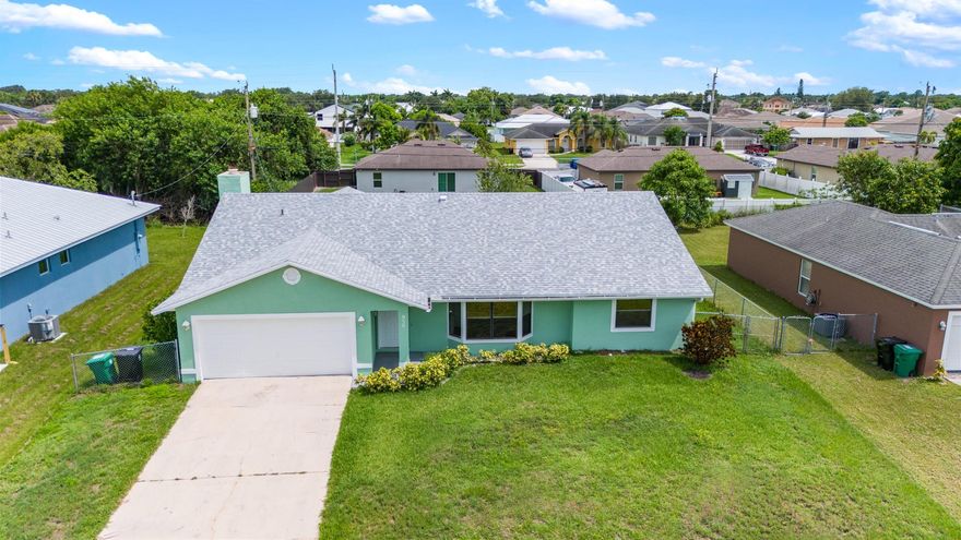 Welcome to 950 SW Jaslo Ave - BRAND NEW ROOF (2025) and Exceptional Value! This charming 3-bedroom, 2-bath home in a peaceful Port St. Lucie neighborhood with no HOA offers a perfect blend of comfort, convenience, and privacy. Just minutes from Tradition, I-95, schools, shopping, and dining. The spacious split-bedroom floor plan and generous screened-in patio are ideal for relaxing and entertaining. The fresh exterior paint adds to its curb appeal, and the spacious backyard offers plenty of room for a pool. This home is priced to sell! And offers plenty of space. Whether you're a first-time buyer, investor, or simply looking for a new place to call home, this property provides incredible potential and is ready for you to move in!