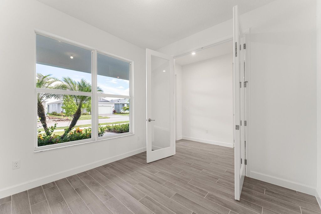 Photo of 9570 SW Indra Way, Port Saint Lucie, FL 34987 (MLS # R11128901)