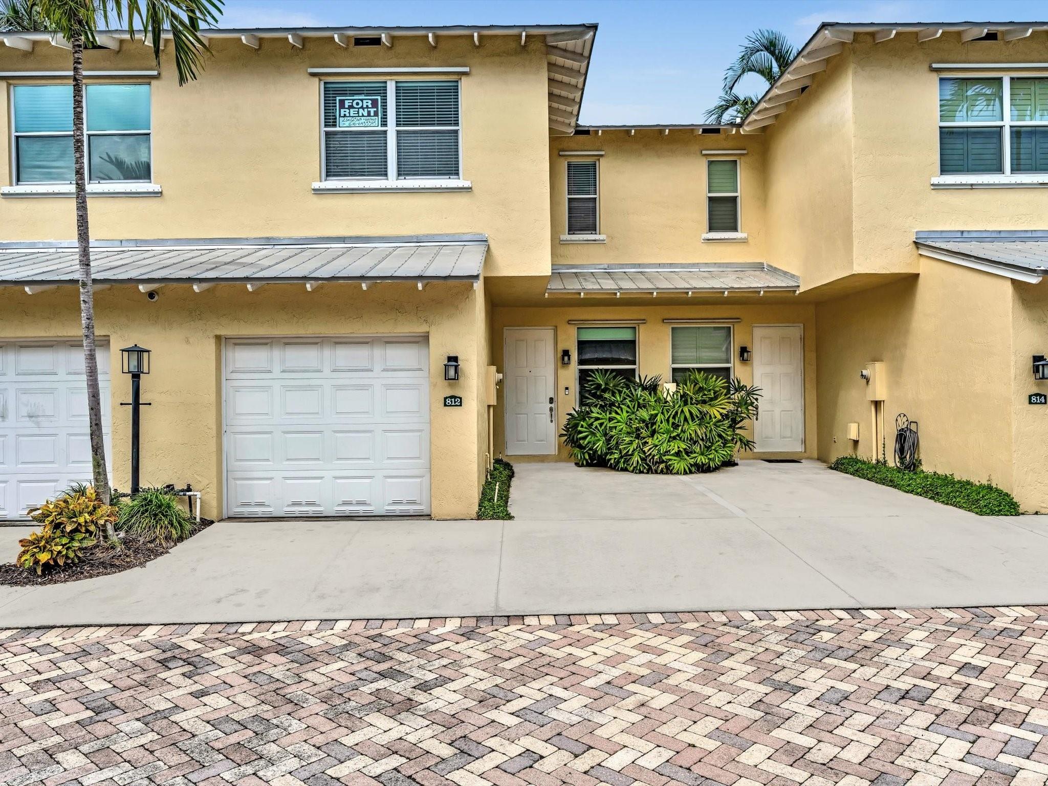 Experience the good life in East Deerfield—just 1.5 miles from the beach and only 1 mile from the vibrant Cove! This updated 3 BED townhome with 1 CAR GARAGE is located right off US1, within walking distance to everything you need—LA Fitness, Publix, Starbucks, great restaurants, and more. Florida Bungalows has a community pool, paved courtyard, and is gated with only 20 units; creating an intimate and private environment for families. The 1st floor you'll find the kitchen, living room, half bathroom, and laundry all with updated large white marble tile flooring. Upstairs is beautiful wood flooring and two master bedrooms with separate full bathrooms. This townhome also includes has a private back patio.