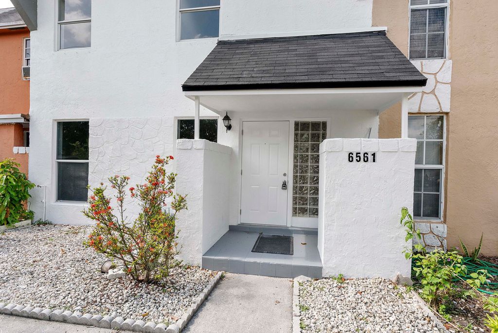 Photo of 6561 Boulevard Of Champions, North Lauderdale, FL 33068 (MLS # B26025008)