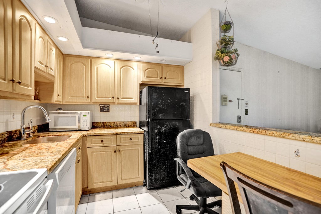 Photo of 9414 S BELFORT Circle #215, Tamarac, FL 33321 (MLS # B26079096)