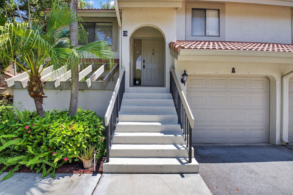 Photo of 5530 Coach House Circle #E, Boca Raton, FL 33486 (MLS # B26023824)