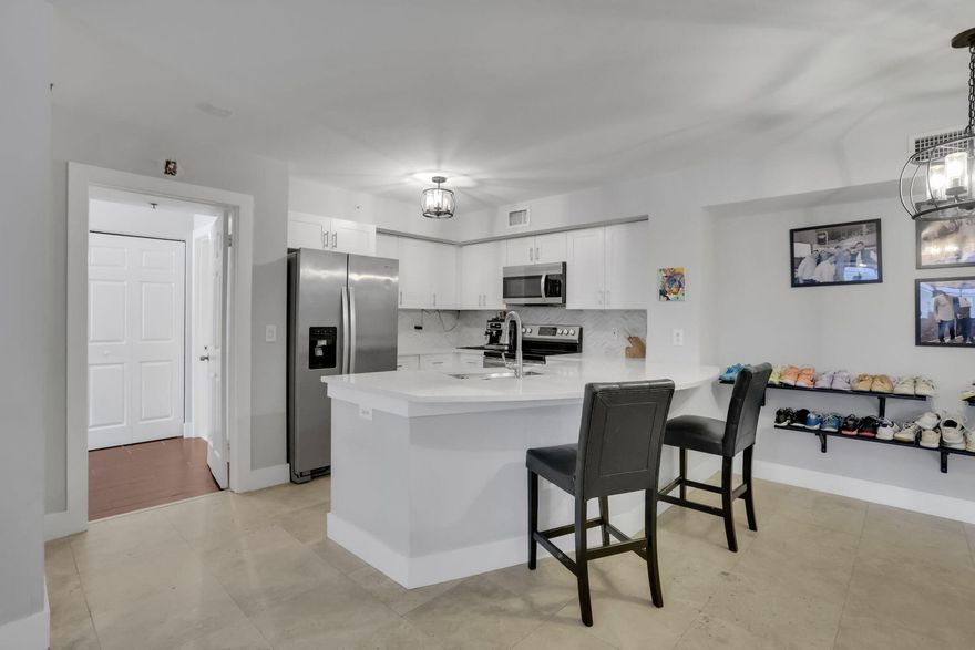Welcome to this 2-bedroom, 2-bathroom condo offering the perfect blend of comfort, style, and location. Situated in one of Boca Raton's most sought-after communities, this residence is move-in ready and ideal for full-time living or a seasonal retreat. Step inside to find an open-concept living and dining area with, neutral finishes, and sliding glass door that lead to a private balcony — perfect for enjoying morning coffee or evening sunsets. The modern kitchen features sleek cabinetry, stainless steel appliances, and ample counter space for both cooking and entertaining. The spacious primary suite offers a walk-in closet and a renovated en-suite bathroom, while the second bedroom and full guest bath provide plenty of room for family or visitors.