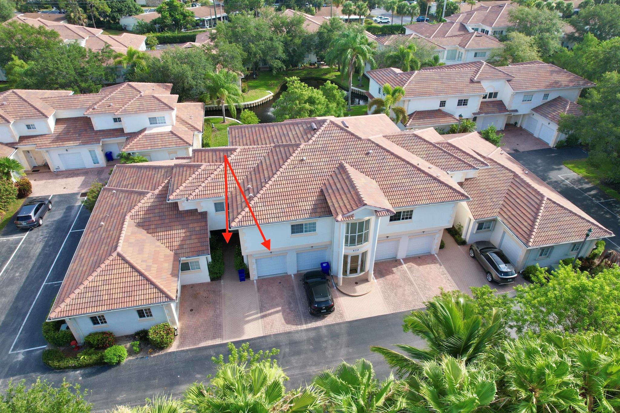 Welcome to your slice of paradise on the Treasure Coast of Florida. Located in the sought after private gated community of Fountainhead. Just minutes from pristine beaches, fine dining, shopping and the Vero Beach Theatre. This beautifully maintained 2/2 condo has been freshly painted and has a one car garage. Comes with washer, dryer, stove, refrigerator, hot water heater, microwave, range and refrigerator. New roofs put in place in 2024. Easy living is right at your fingertips.