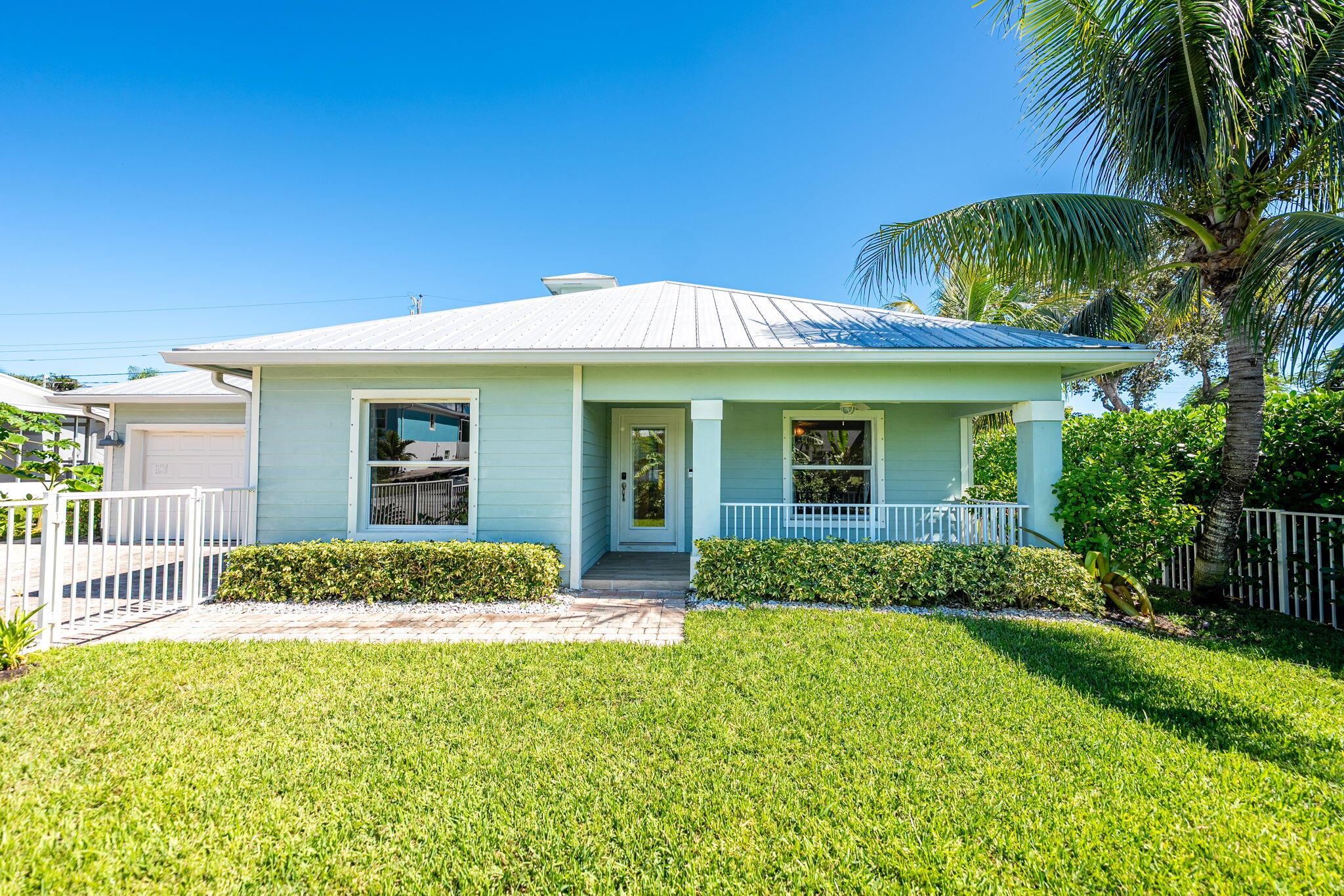 Nestled in the desirable Skyline Heights area of Jensen Beach, 3773 NE Barbara Drive offers a true slice of Key West style living This move-in-ready CBS home is just five minutes from downtown Jensen and a public boat ramp, and only ten minutes from the beach, making it ideal for those who love a coastal lifestyle. The interior is light and bright and features stainless steel appliances, a kitchen island, granite countertops with a marble subway tile backsplash, and cove ceilings. New high-end luxury vinyl plank flooring was installed throughout the home in 2023, and the walls and ceilings were repainted the same year. The second bedroom includes a walk-in closet for additional storage. Major updates include a new AC unit in 2024 and a brand new dishwasher in 2025.