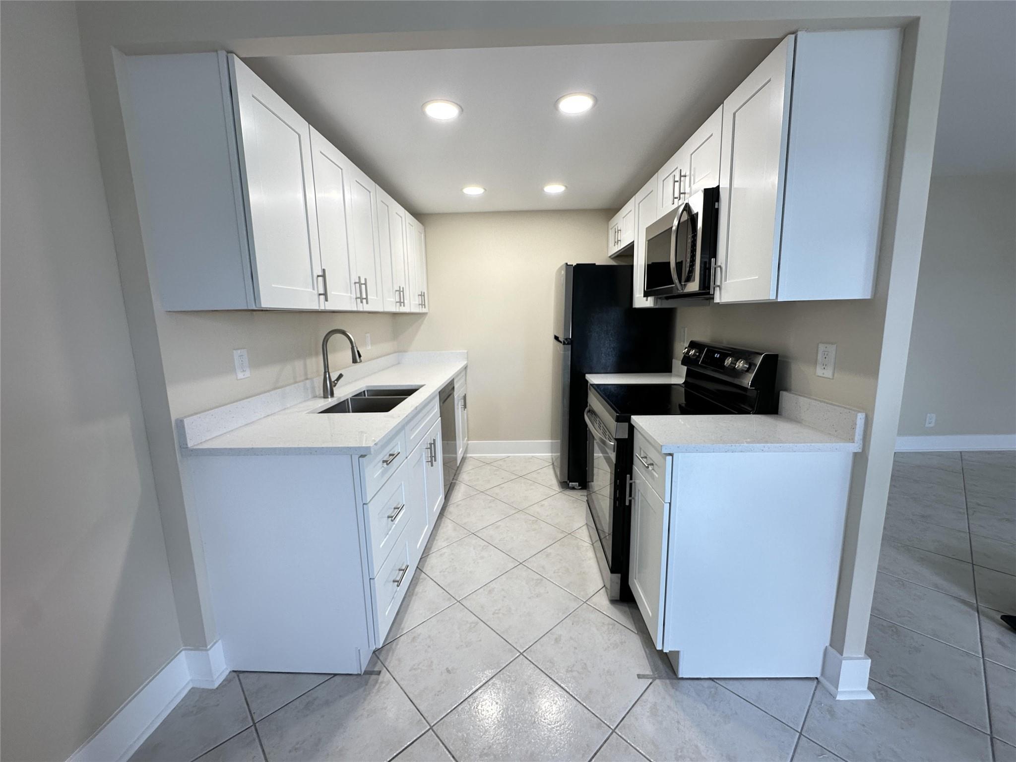 Fully Renovated 2 Bed, 1 Bath and Half Condo in 55+ Century Village, Boca Raton
Welcome to this beautifully renovated 2-bedroom, 1-bathroom and a half condo located in the highly desirable 55+ community of Century Village in Boca Raton. This move-in ready home features a modern open-concept kitchen, and abundant natural light. Enjoy tranquil views from the screened balcony and the convenience of resort-style amenities including a clubhouse, fitness center, pool, tennis courts, and more. Prime location close to shopping, dining, and major highways. Experience vibrant, active adult living in a gated community with 24/7 security.