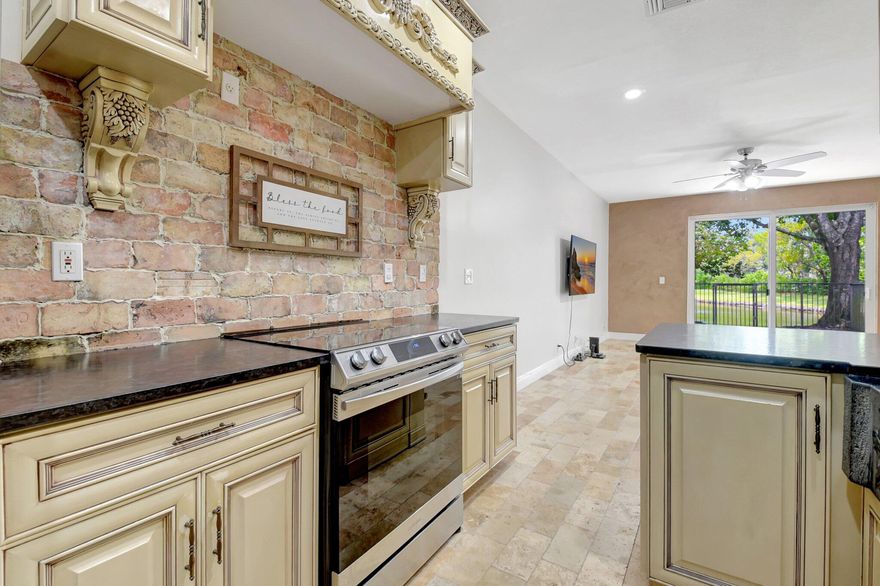 Luxury Completely remodeled townhouse, / car garage/lake/travertine patio/wood cabinet kitchen /Leather granite black color / stainless steel appliances/ Chicago brick splash and walls/ Travertine floor and patio /Brazilian hardwood floors / SPECIAL VENETIAN WALLS / Gated community /swimming pool/clubhouse / New roof/ new A/C /Impact windows/ HOA includes basic cable. Security gate and common areas, lawn. Walk to school. A ONE OF A KIND..Hurry will NOT last!