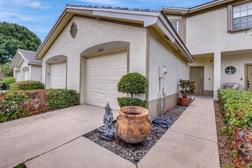 Luxury Completely remodeled townhouse, / car garage/lake/travertine patio/wood cabinet kitchen /Leather granite black color / stainless steel appliances/ Chicago brick splash and walls/ Travertine floor and patio /Brazilian hardwood floors / SPECIAL VENETIAN WALLS / Gated community /swimming pool/clubhouse / New roof/ new A/C /Impact windows/ HOA includes basic cable. Security gate and common areas, lawn. Walk to school. A ONE OF A KIND..Hurry will NOT last!